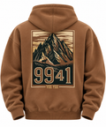 A brown pullover hoodie shown from the back, featuring a large graphic print of a mountain peak with the numbers '9941' and the text 'YEE YEE' in a vintage poster style.