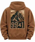A brown pullover hoodie shown from the back, featuring a large graphic print of a mountain peak with the numbers '9941' and the text 'YEE YEE' in a vintage poster style.